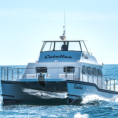 The Catallac whale watching boat cruising in Newport Beach.